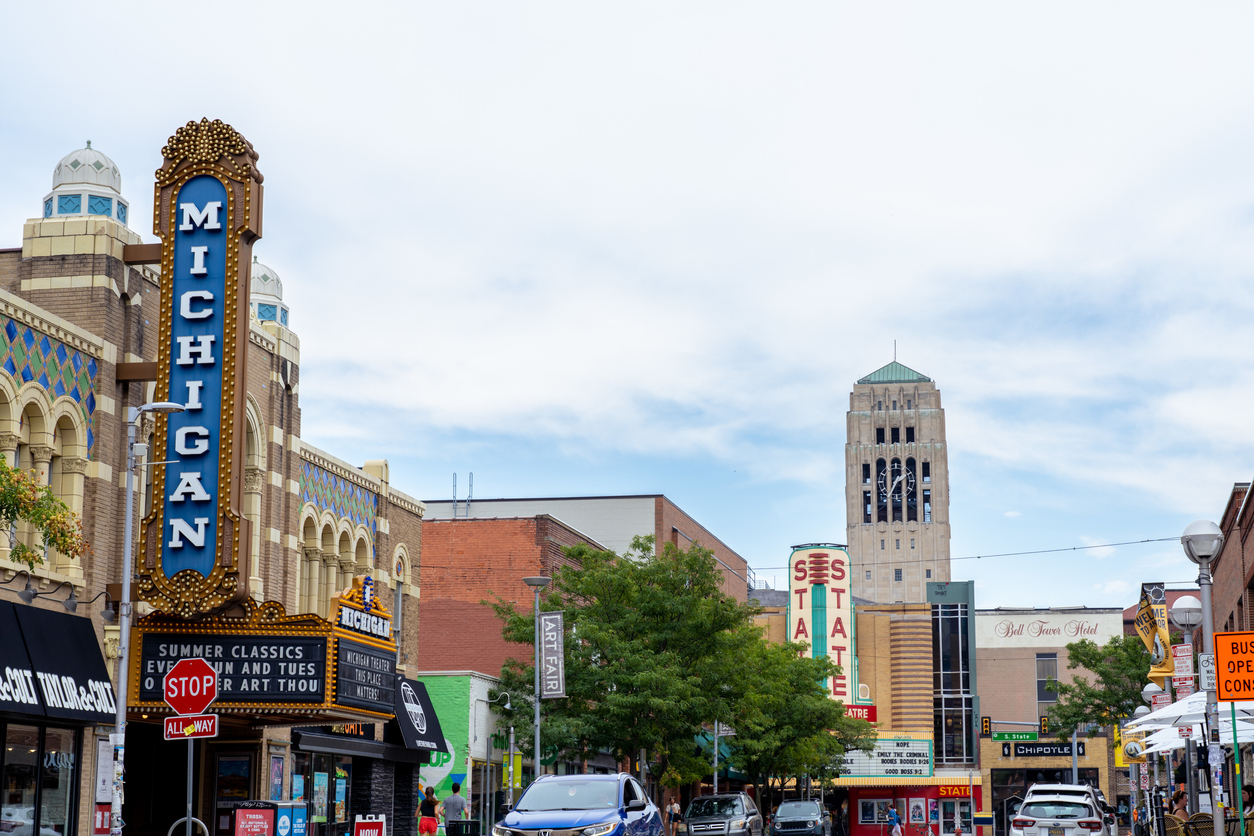 Ann Arbor downtown, Michigan Theater marquee, wide streetscape view, bright midday light, editorial travel photo, no people.