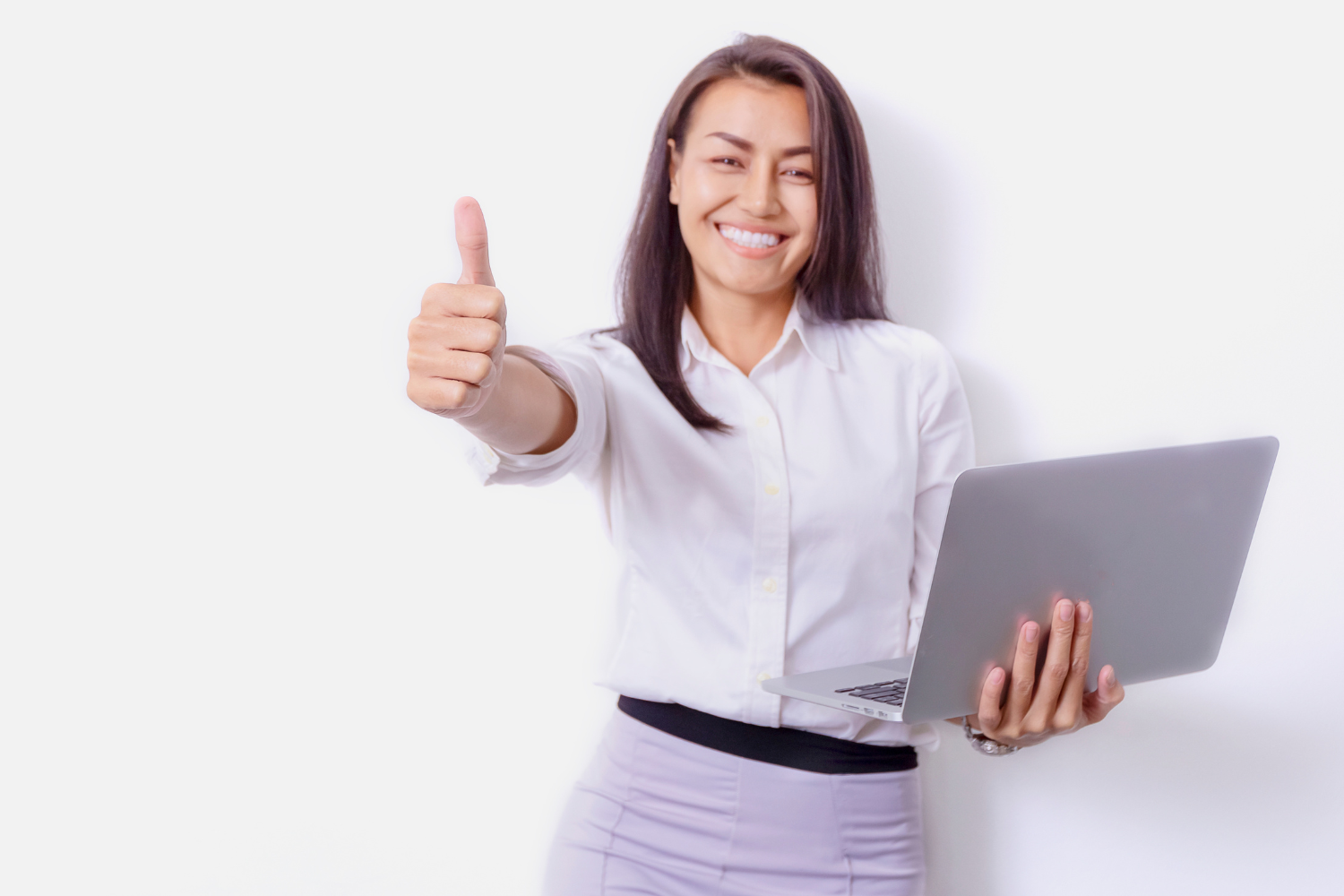 White background, woman with laptop and thumbs-up, centered composition, bright lighting, corporate portrait style, one person.